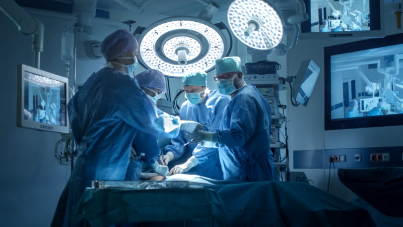 Medical Team Performing Arterial Operation in Operating Theatre